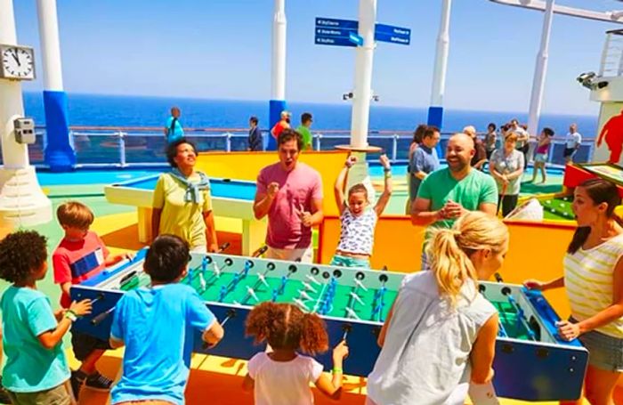 a group of individuals enjoying a foosball game at SportSquare