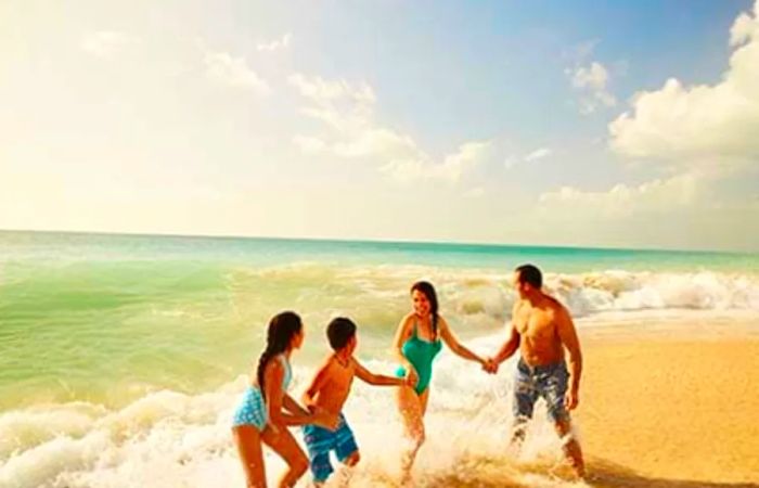 family enjoying their time at the beach