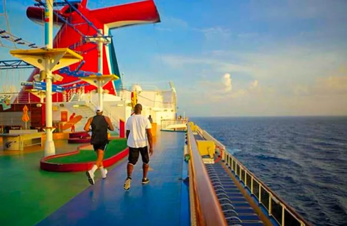 two men jogging on the onboard track