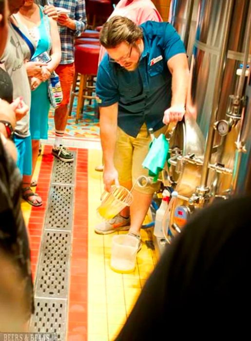 Brewmaster Colin Presby pours fresh IPA directly into a pitcher from the serving tank.