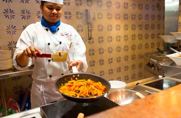 chef creating a pasta dish at Pasta Bella