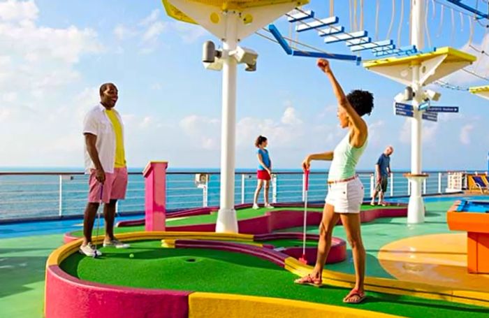 a couple enjoying a round of mini golf