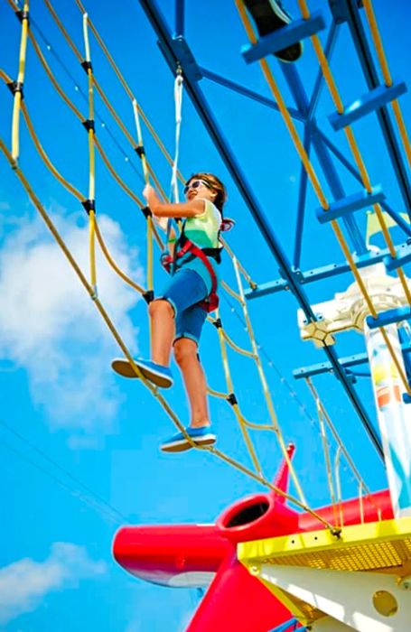 young girl navigating the ropes course in SportSquare