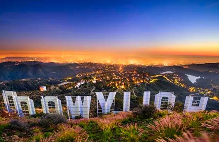 A breathtaking sunset over Los Angeles from behind the Hollywood Sign