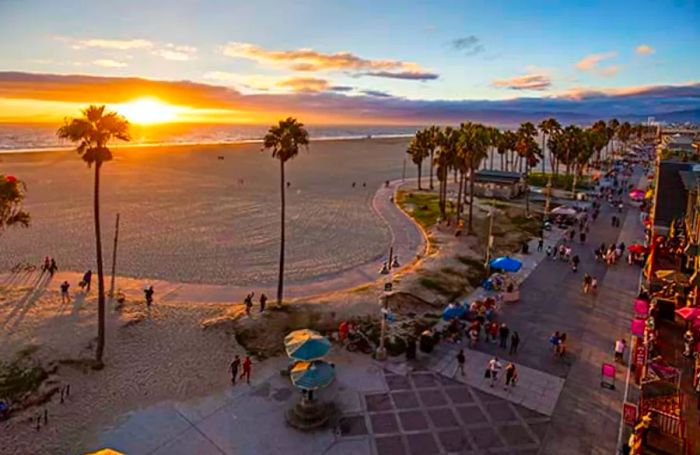 Venice Beach glowing under a sunset sky