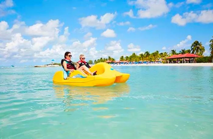 two women paddle wheeling in Princess Cays