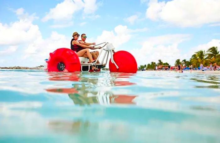 a couple enjoying an aqua bike ride in Princess Cays