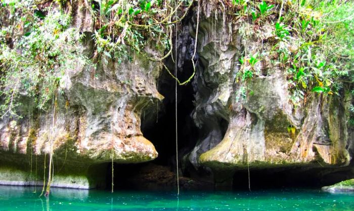 A cave along a river in Belize.