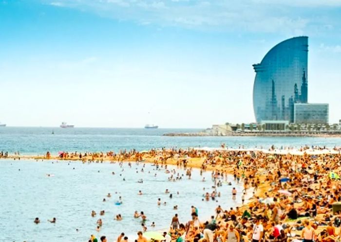 an aerial perspective of La Barceloneta on a bustling day