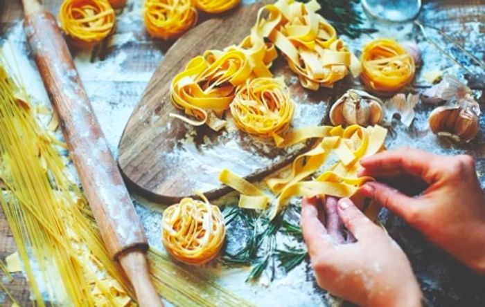 a chef skillfully making pasta by hand