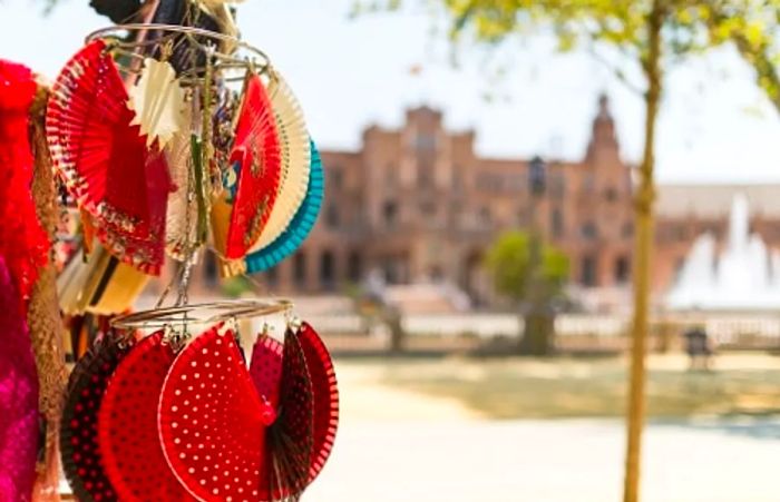 a collection of Spanish flamenco fans displayed in a market in Spain