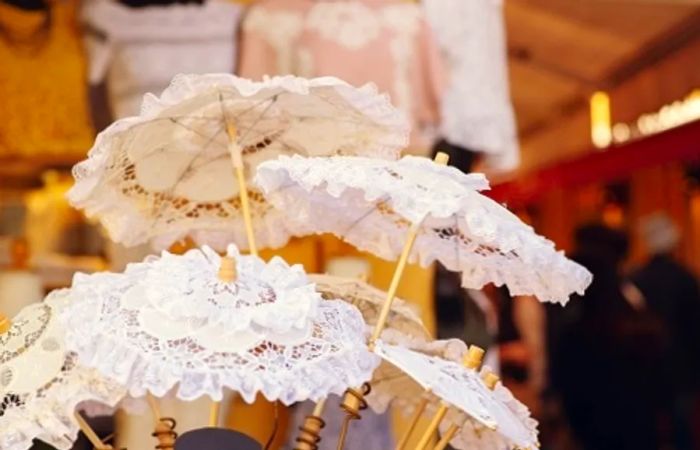 Burano lace umbrellas, or parasols, available at a market in Venice, Italy