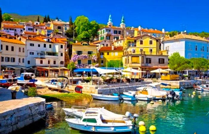 the marina in Opatija with boats and the village in the backdrop