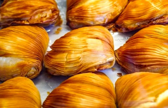 A selection of sfogliatelle displayed at a bakery