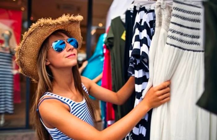 a young girl in Rome browsing Italian fashion