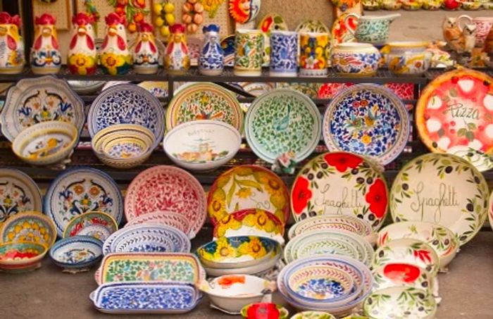 a showcase of Italian ceramics at a market in Rome