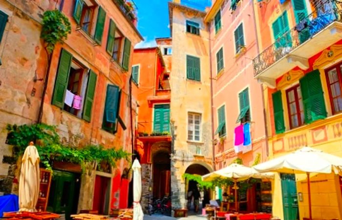 Colorful buildings and a narrow street in Monterosso, Italy