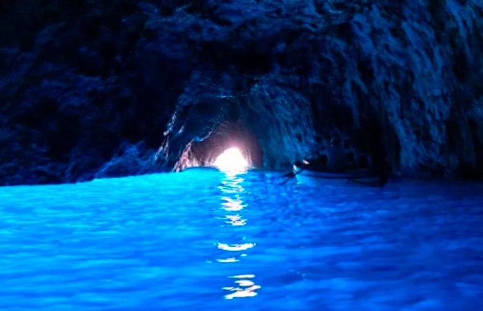 two individuals kayaking in the Blue Grotto