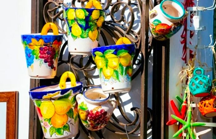 vibrant ceramic pots adorning a gate in italy