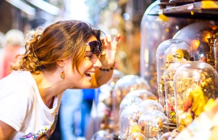 a woman admiring nativity figures in naples, italy