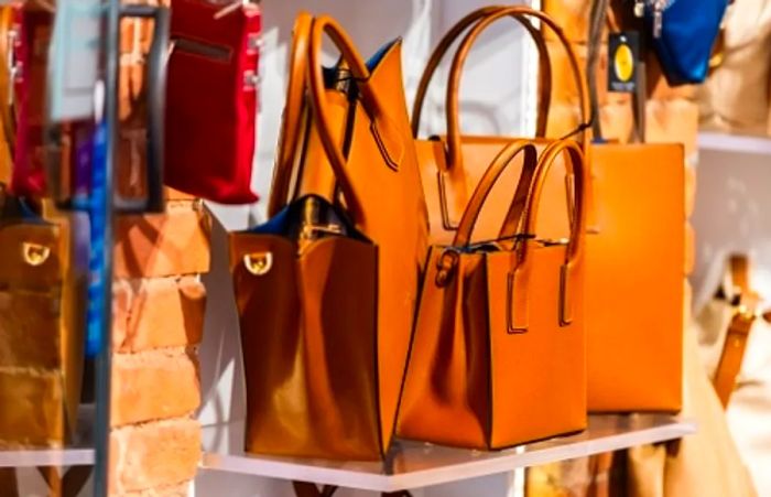 a collection of Italian leather handbags on display