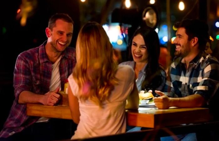 friend savoring food and drinks at a local restaurant in yaletown