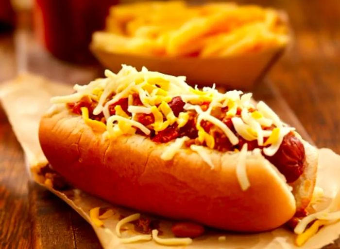 A JapaDog from Victoria served on a napkin, accompanied by French fries