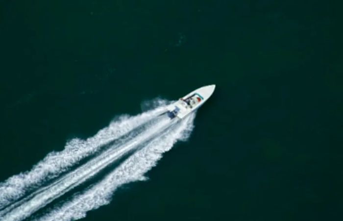 a speedboat racing along the stunning coastline of Mazatlan, Mexico