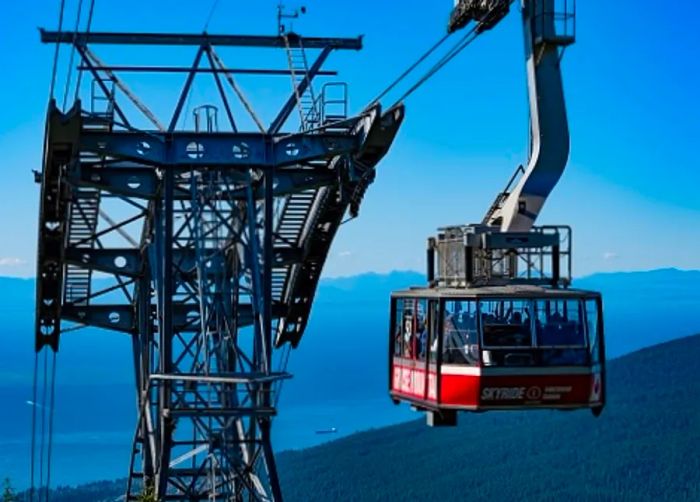 people enjoying the skyride in vancouver as they ascend to the summit of grouse mountain