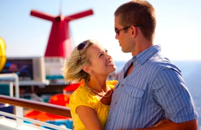 a couple gazing at each other on the deck of a Dinogo cruise ship