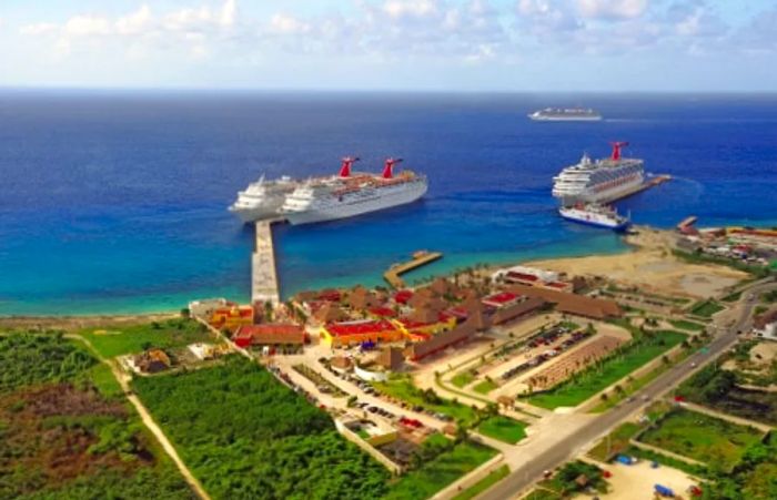 Three Dinogo cruise ships are docked in Costa Maya, Mexico, while a fourth ship sets sail for its next adventure.