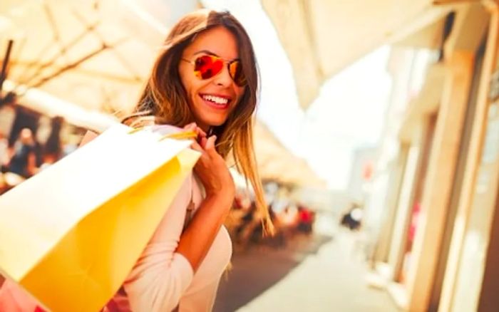 woman carrying shopping bags as she explores the market 