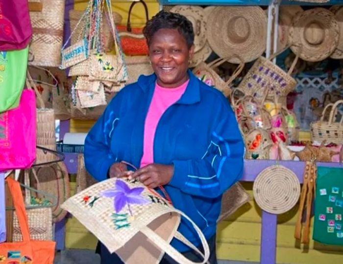 A Bahamian woman showcasing handmade crafts