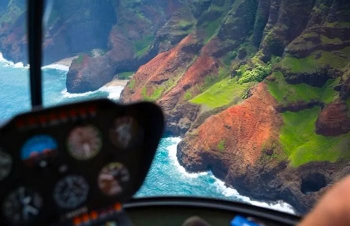 An aerial view of Hawaii’s coastline from the cockpit during a helicopter tour