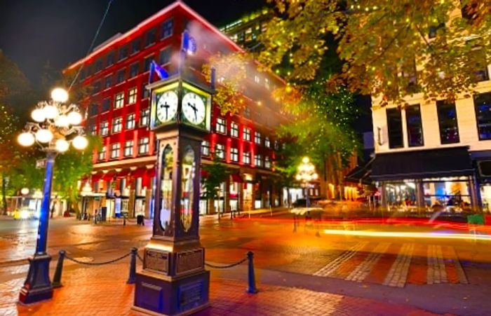 view of a local street clock in gastown in vancouver at night