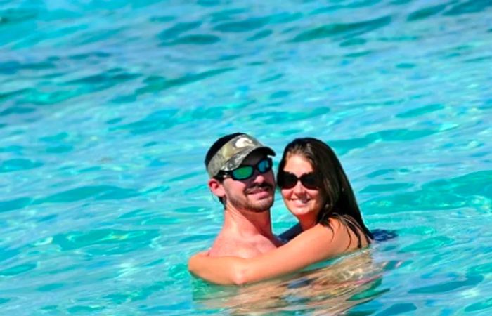 a couple embracing in the waters of La Romana