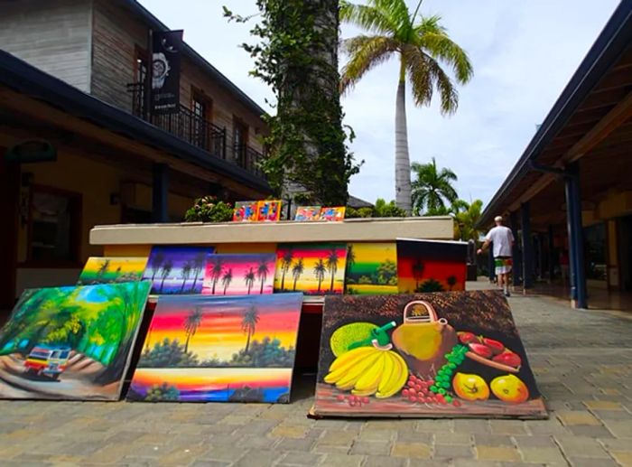 numerous Jamaican paintings available for sale on the streets of Montego Bay