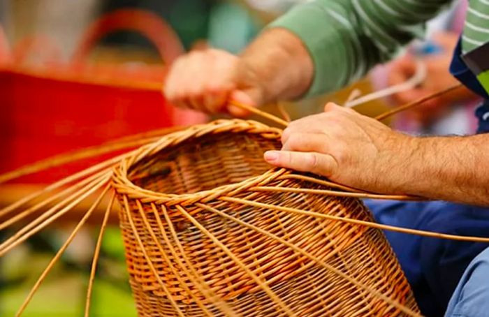 a craftsman weaving baskets from straw