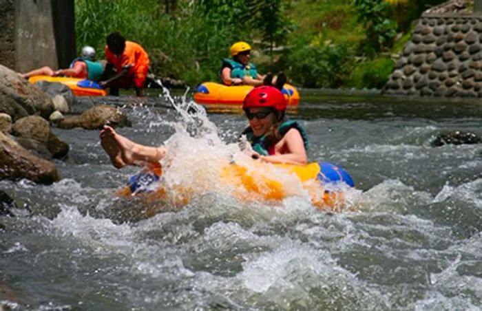 a woman tubing down the Balthazar River