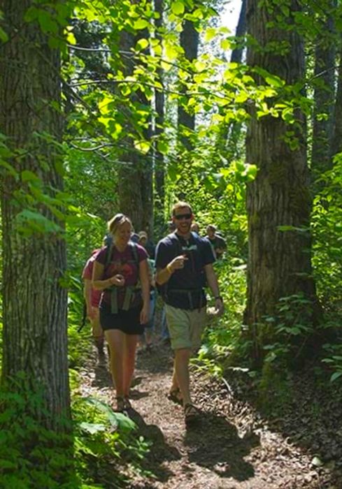 a group of hikers navigating the Chilkoot Trail in Alaska with a guide