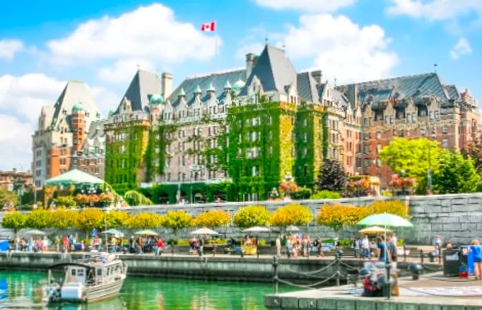 A view of the inner harbor featuring a historic hotel in Victoria, British Columbia