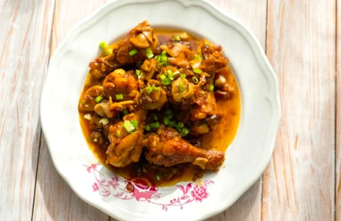 Dominican pollo guisado – chicken stew – beautifully presented in a white bowl