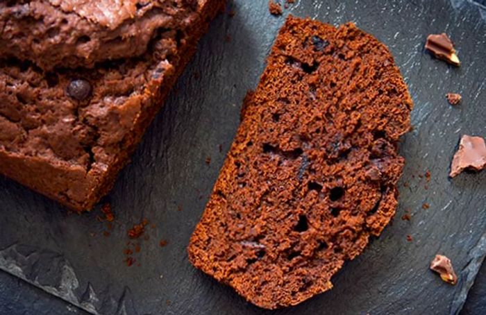 a slice of bolo pretu, or black rum cake