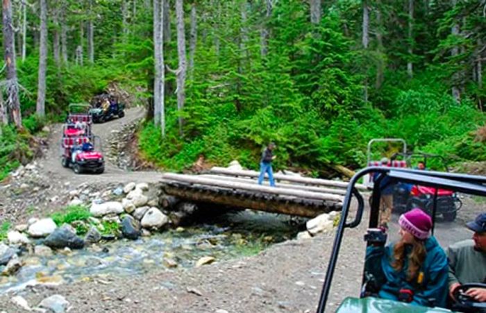 a group of adventurers exploring the Takshanuk Mountain Trail in Skagway via 4x4