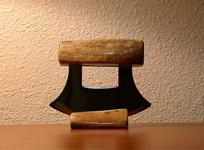 ulu knife from Alaska displayed on a wooden stand