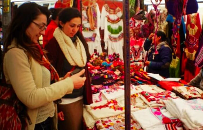 two women shopping for handmade souvenirs in Progreso, Mexico