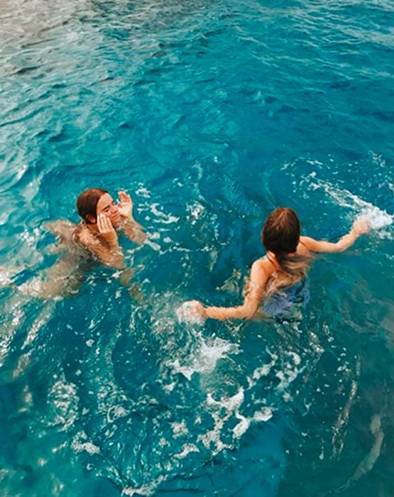 Tess & Sarah swimming on the water's surface