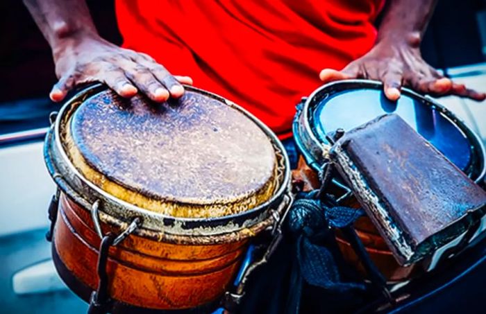 hands of a street musician playing drums