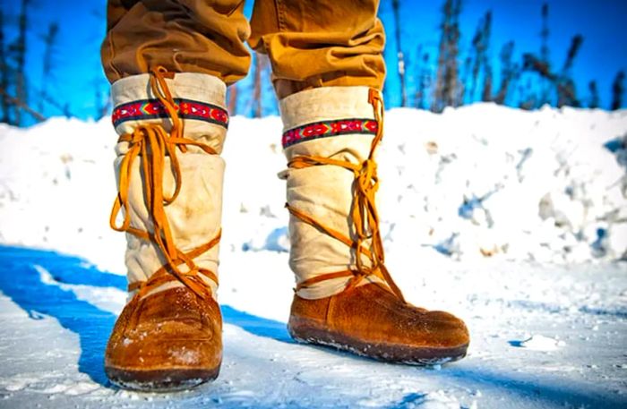 brown Alaskan mukluks worn on a snowy day