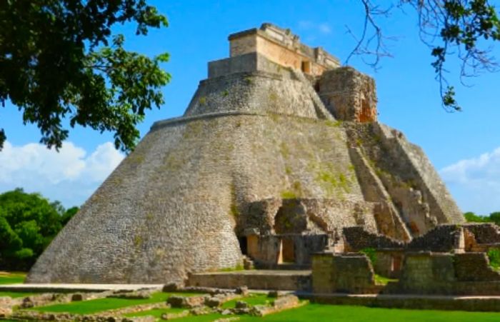 a ground view of the Pyramid of the Magician at Uxmal Mayan Ruins